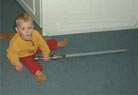 Jeroen age 1 (2001), already fond of daddy's spatha!