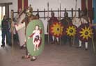 Cesar as a third-century legionary, with the large scutum with the god painted on it.