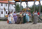 The Roman ladies performing their own 'fashion show'.
