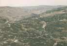 Contested land - looking across Palestinian and Jewish villages towards the hills of Judea.